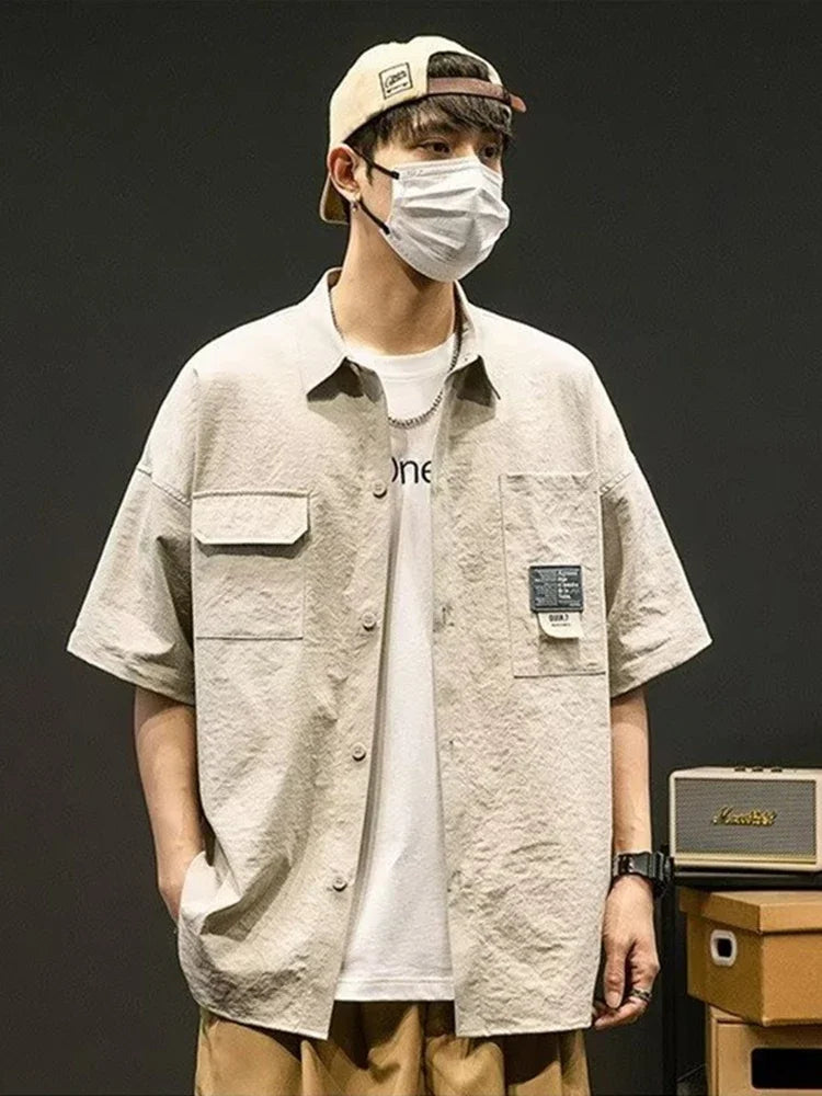 Chemises à manches courtes pour hommes pour l'été Chemises japonaises décontractées à col chemisier Chemises oversize à multiples poches de grande marque Chemises tendance pour hommes