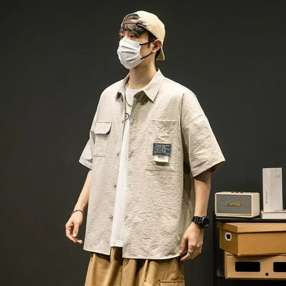Chemises à manches courtes pour hommes pour l'été Chemises japonaises décontractées à col chemisier Chemises oversize à multiples poches de grande marque Chemises tendance pour hommes