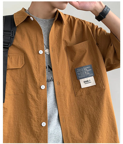 Chemises à manches courtes pour hommes pour l'été Chemises japonaises décontractées à col chemisier Chemises oversize à multiples poches de grande marque Chemises tendance pour hommes