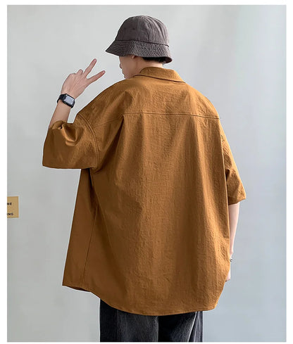 Chemises à manches courtes pour hommes pour l'été Chemises japonaises décontractées à col chemisier Chemises oversize à multiples poches de grande marque Chemises tendance pour hommes